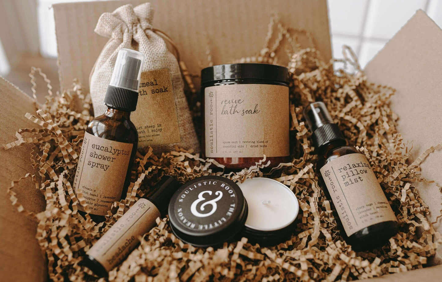 Spa gift set featuring bath soak, essential oils, and aromatherapy products in a natural packaging.