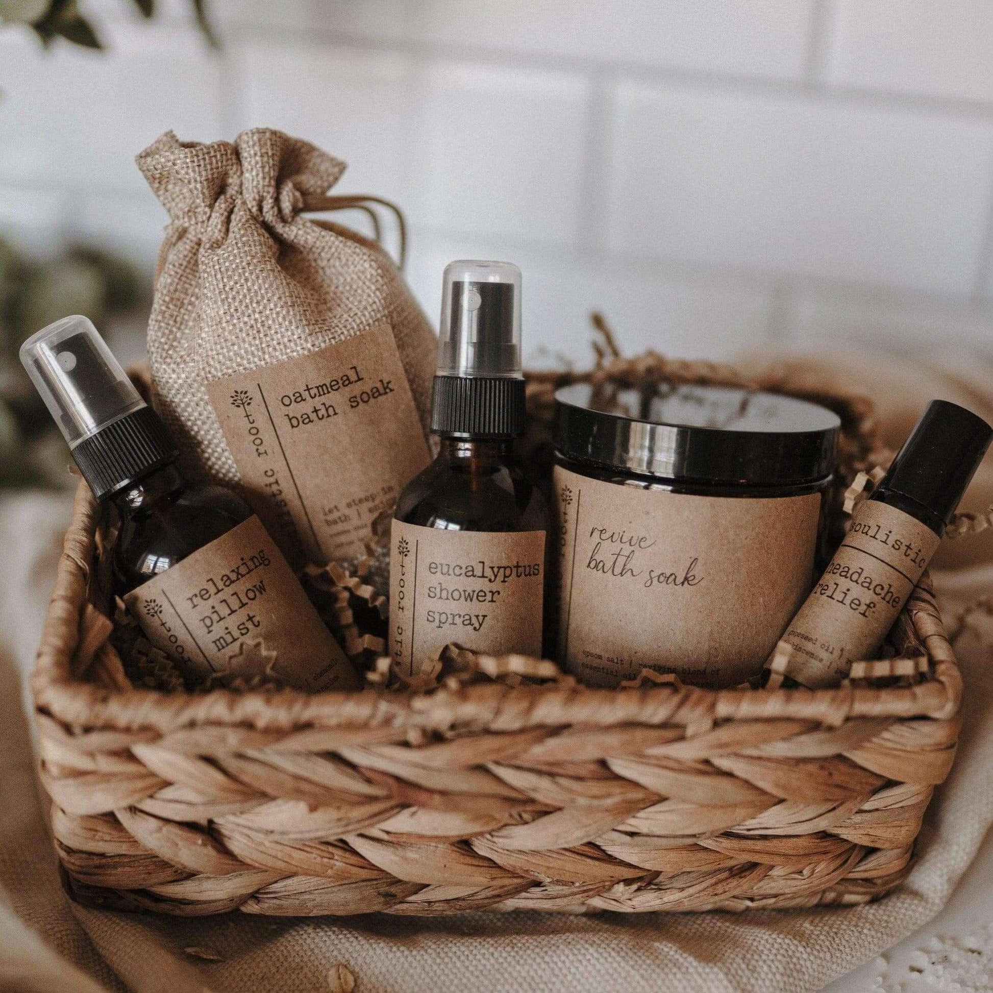 Spa gift set featuring bath products in a woven basket, including bath soaks and shower spray.